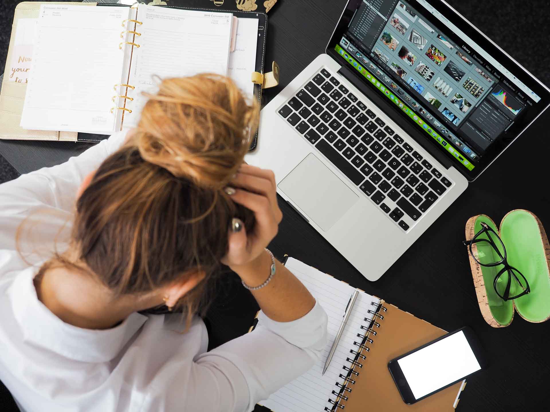 Woman using computer looking frustrated